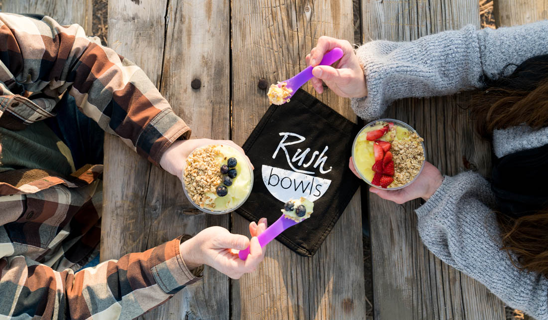 Two delcious healthy smoothie bowls enjoyed by Rush Bowls customers.